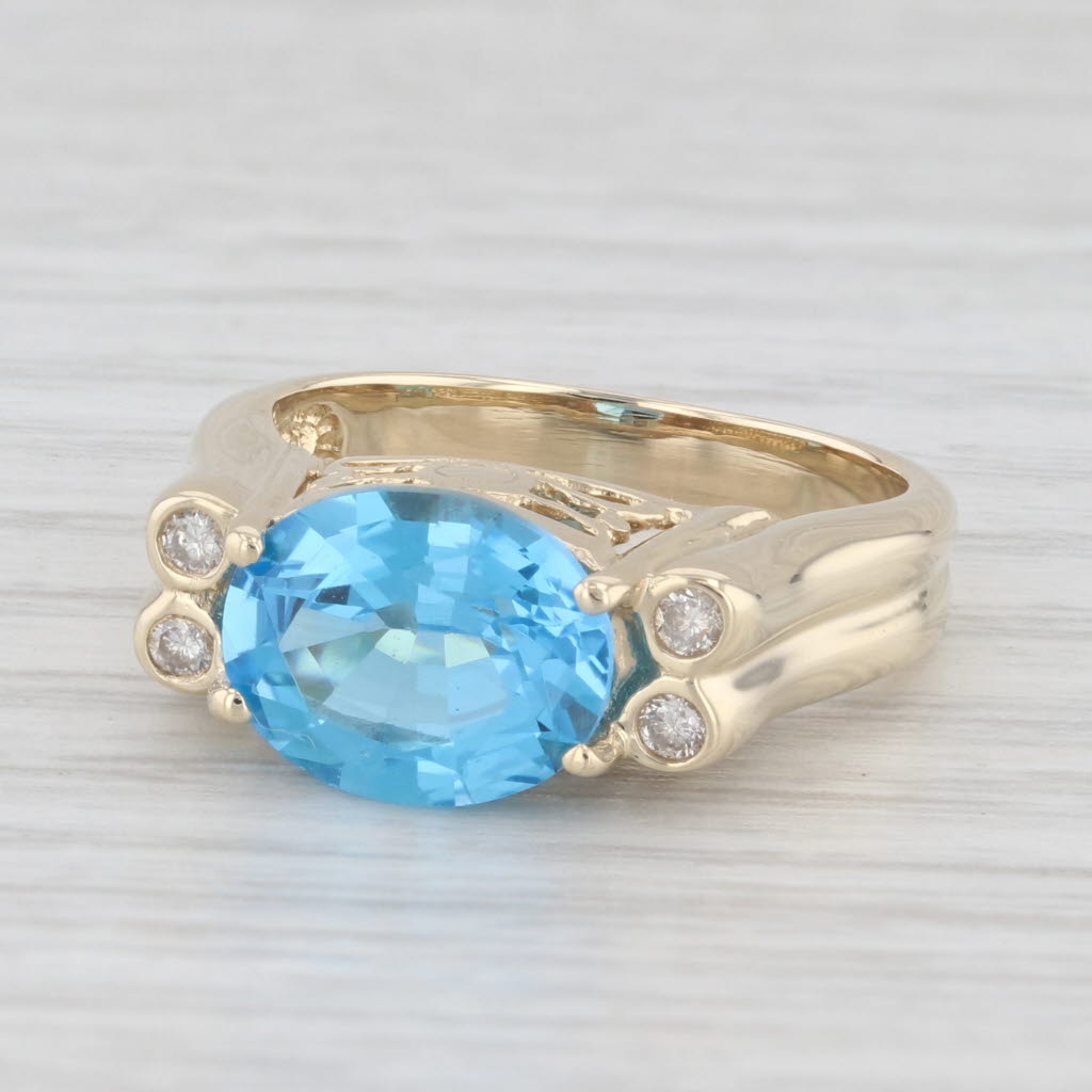 Light Gray 3.29ctw Oval Blue Topaz Diamond Ring 14k Yellow Gold Size 5.75