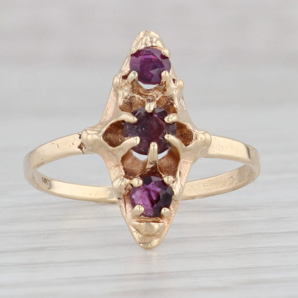 Light Gray Vintage 0.62ctw Ruby 3-Stone Ring 14k Yellow Gold Size 7.75