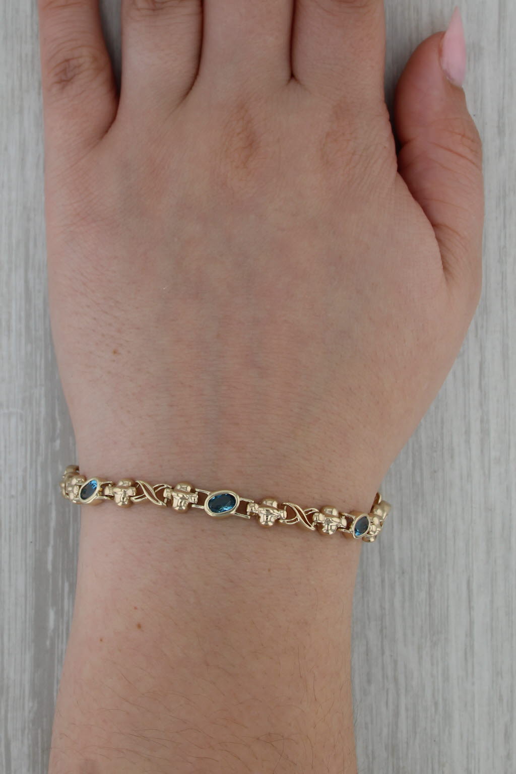 2.68ctw Blue Topaz Infinity Knot Bracelet 14k Yellow Gold 6.75" 6mm