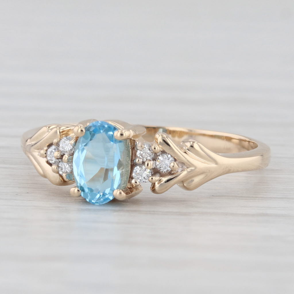 Light Gray 0.60ctw Oval Blue Topaz Diamond Ring 14k Yellow Gold Size 6.25