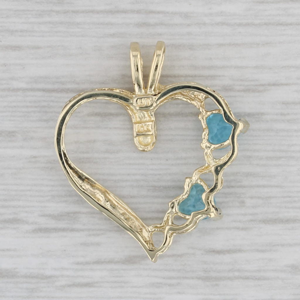 Gray 0.60ctw Blue Topaz Hearts Open Heart Pendant 10k Yellow Gold