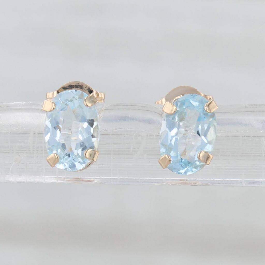 0.90ctw Oval Blue Topaz Stud Earrings 10k Yellow Gold Solitaire Studs