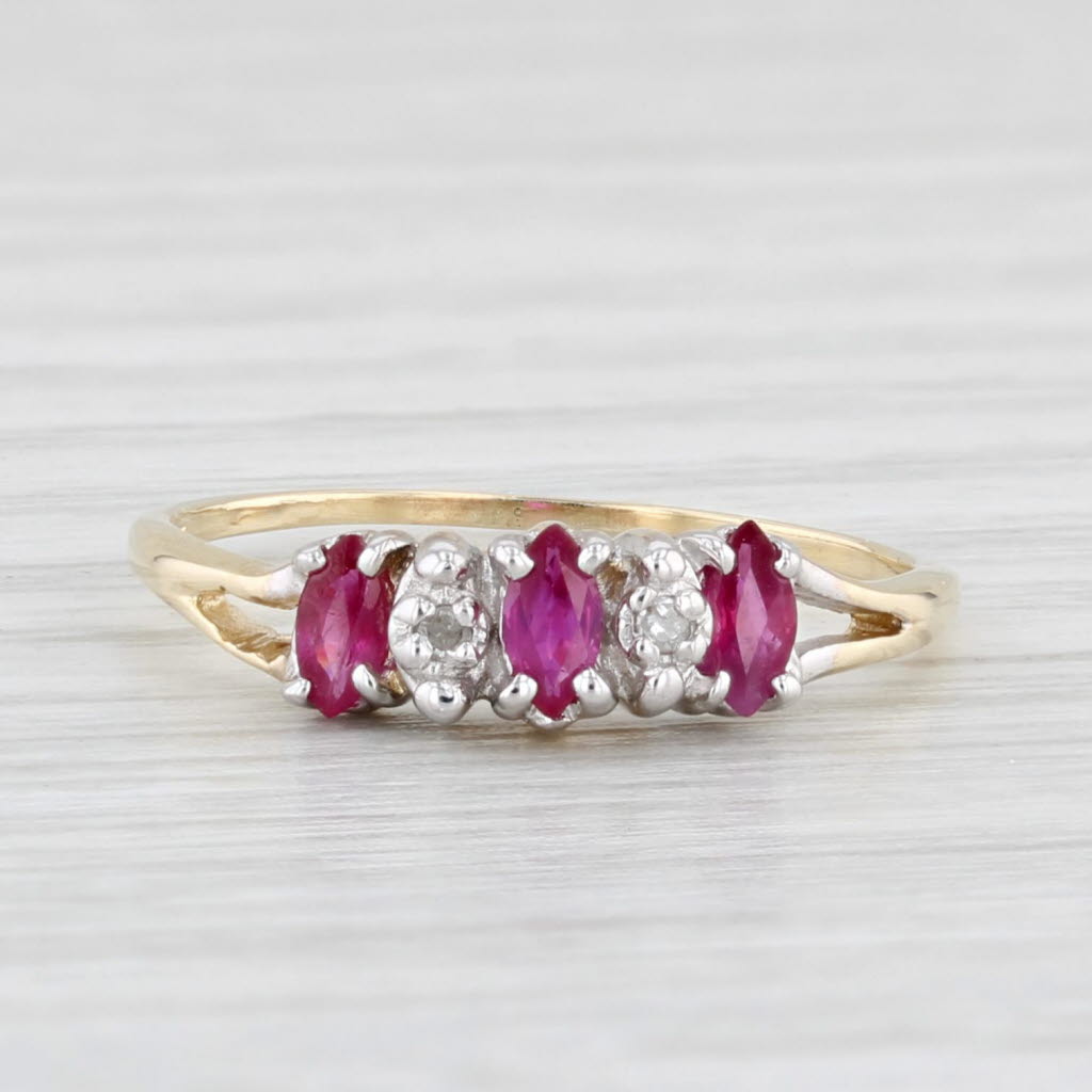 Light Gray 0.30ctw Marquise Ruby 3-Stone Ring 10k Yellow Gold Size 5.25 Diamond Accents