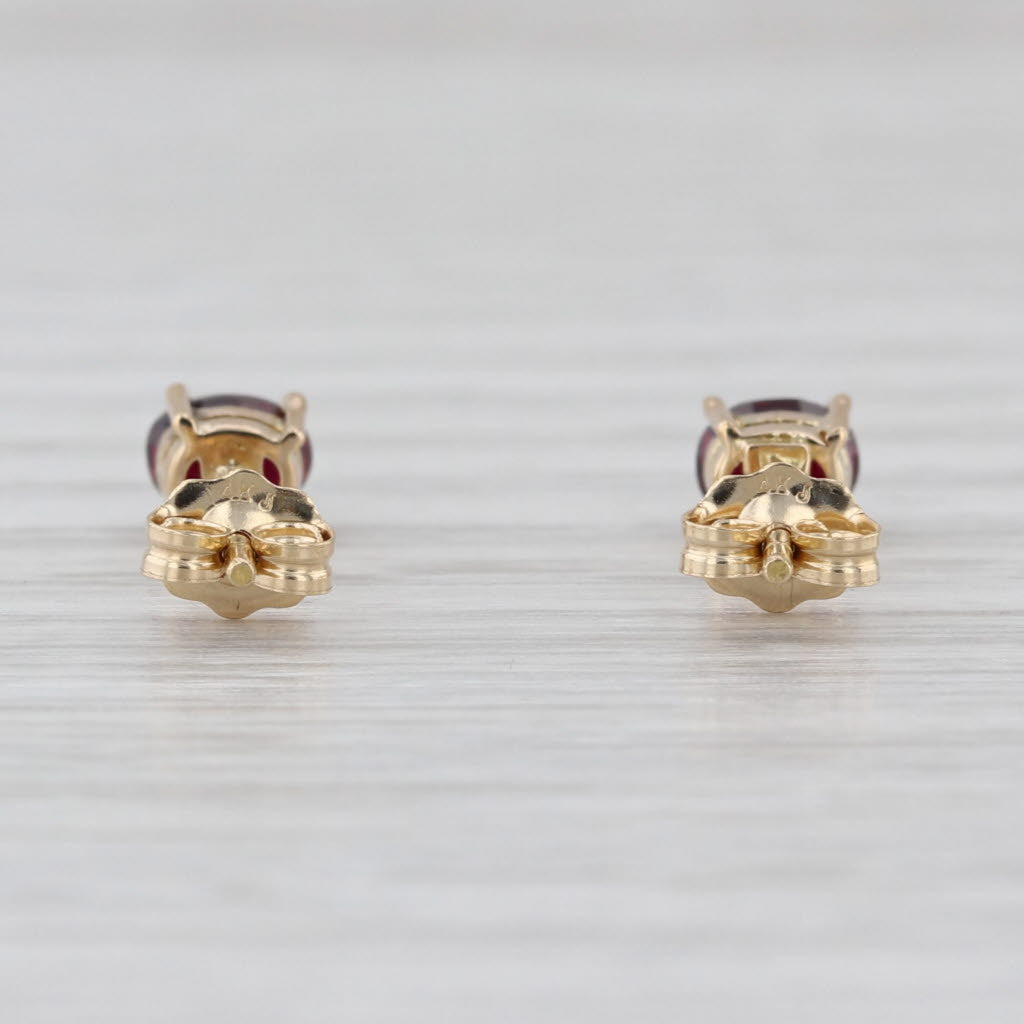 0.54ctw Lab Grown Ruby Stud Earrings 14k Yellow Gold Oval Solitaire Studs