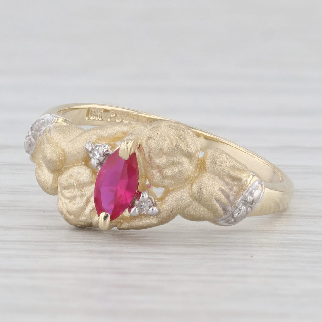 Light Gray 0.20ctw Lab Created Ruby Cherub Ring 10k Yellow Gold Diamond Accents Size 6.75