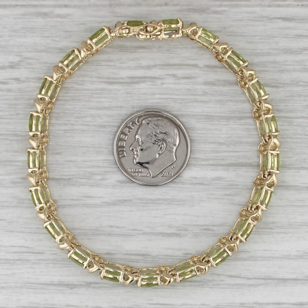 10ctw Light Green Peridot Tennis Bracelet 14k Yellow Gold 6.75" 6.4mm