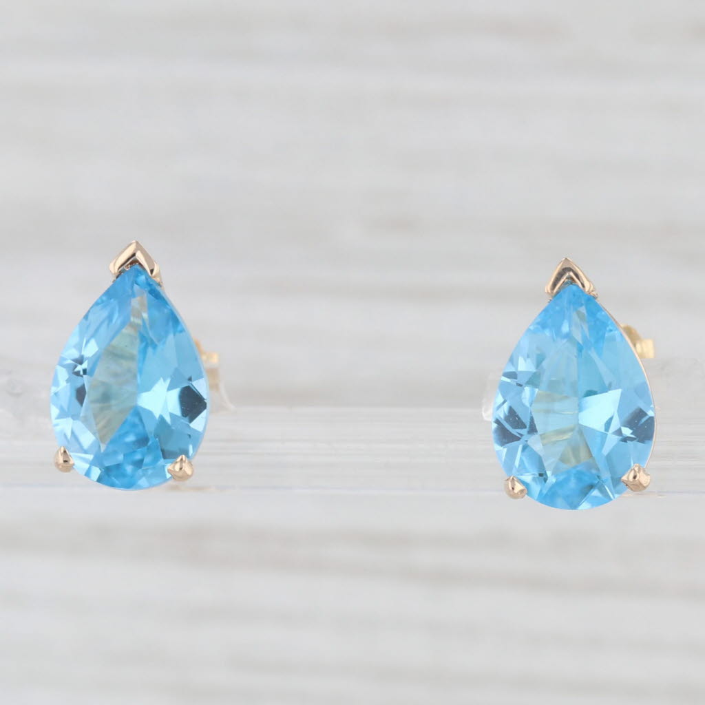 Light Gray 5ctw Pear Solitaire Blue Topaz Stud Earrings 14k Yellow Gold