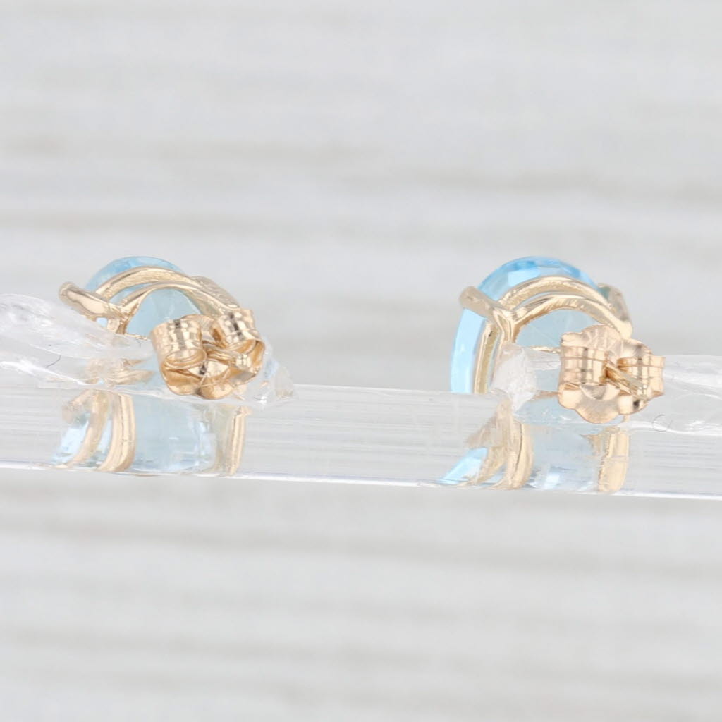 Light Gray 6.60ctw Oval Blue Topaz Solitaire Stud Earrings 14k Yellow Gold