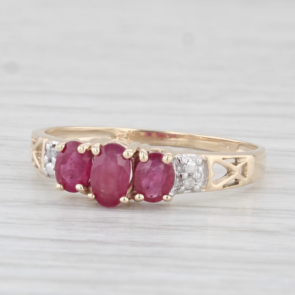 Light Gray 0.78ctw Oval 3-Stone Ruby Ring 10k Yellow Gold Size 7.25 Diamond Accents