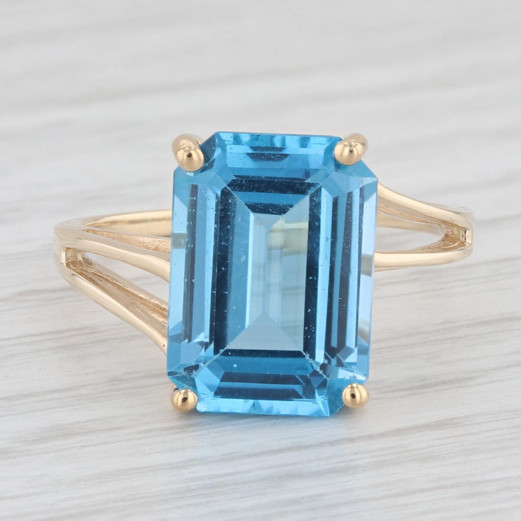 Light Gray 9.10ct Emerald Cut Blue Topaz Solitaire Ring 10k Yellow Gold Size 9