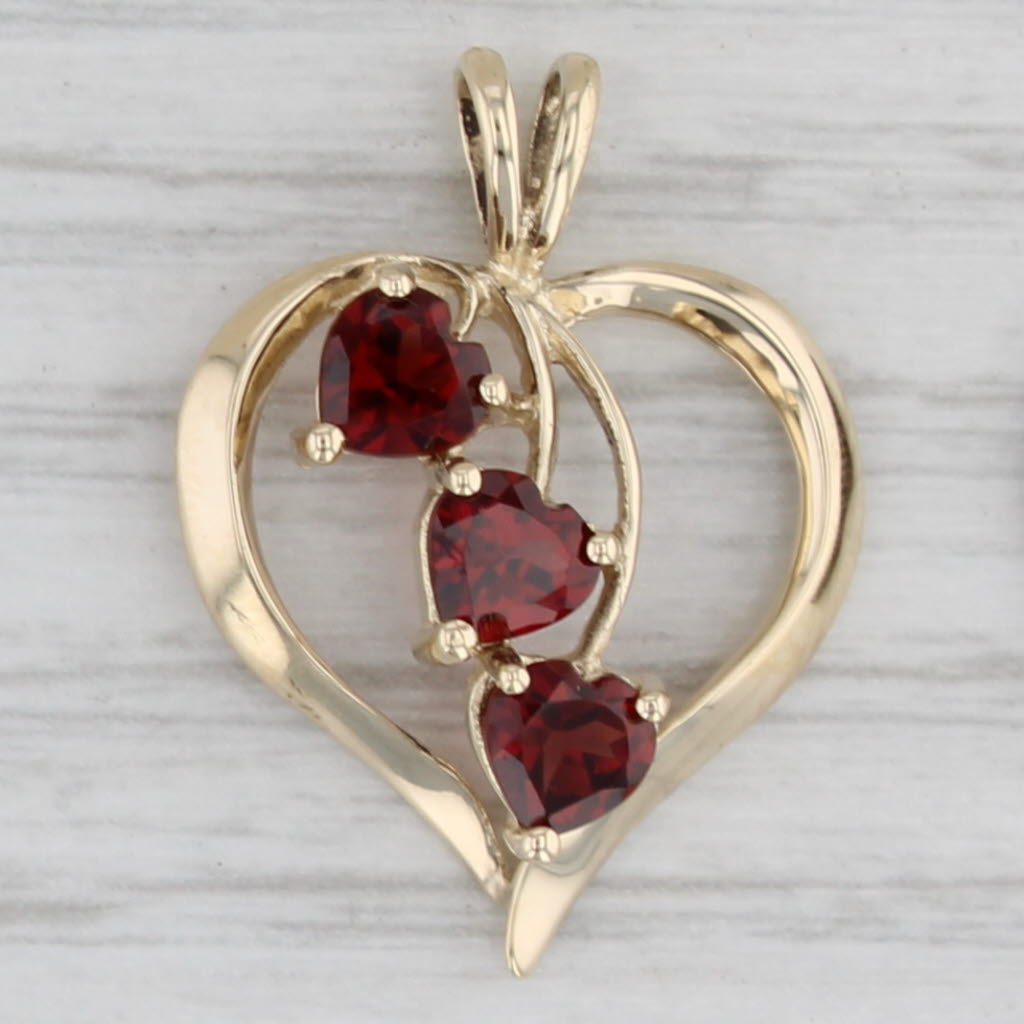 Gray 1.20ctw Garnet Hearts Open Heart Pendant 10k Yellow Gold