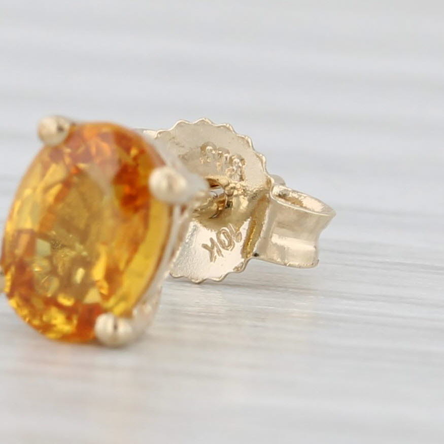 Light Gray 1.20ctw Oval Orange Citrine Solitaire Stud Earrings 10k Yellow Gold