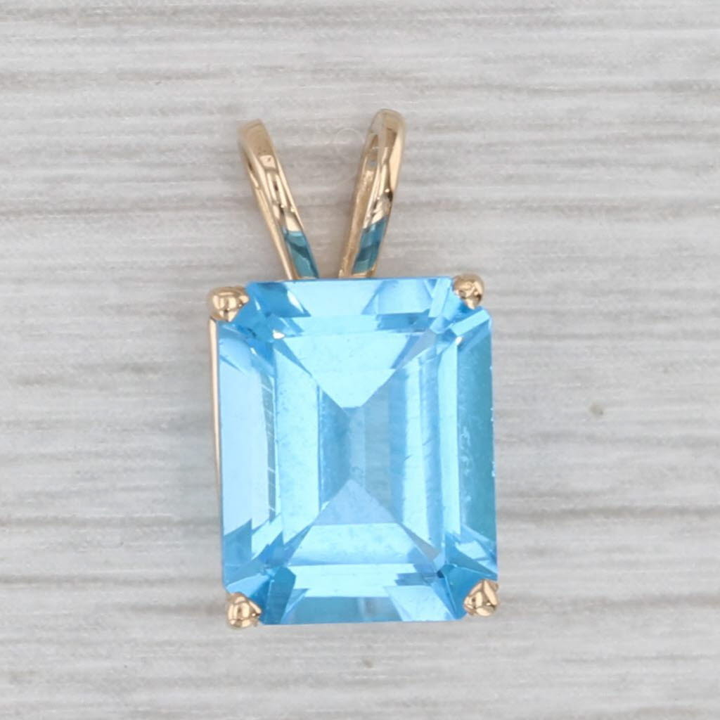 Gray 4.25ct Blue Topaz Emerald Cut Solitaire Pendant 14k Yellow Gold