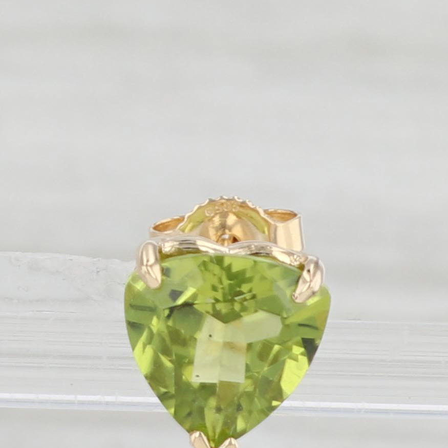 Light Gray 3.20ctw Green Peridot Stud Earrings 14k Yellow Gold Trillion Cut Studs