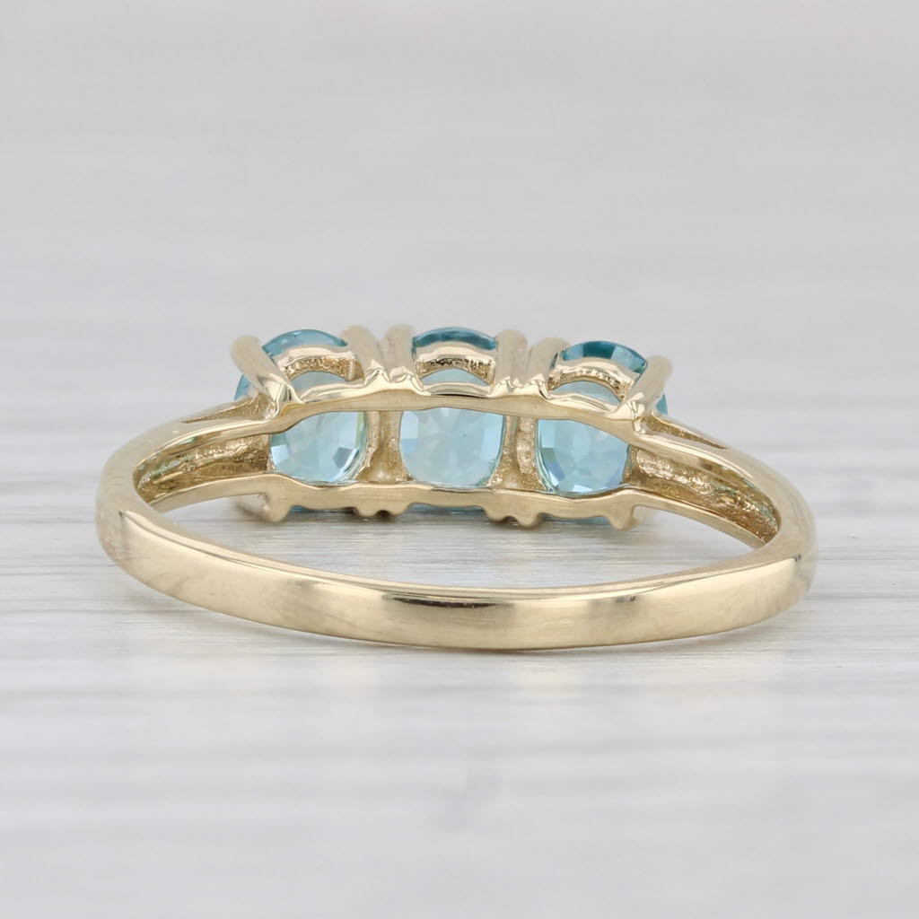 Light Gray 0.90ctw Oval 3-Stone Blue Zircon Ring 10k Yellow Gold Size 7