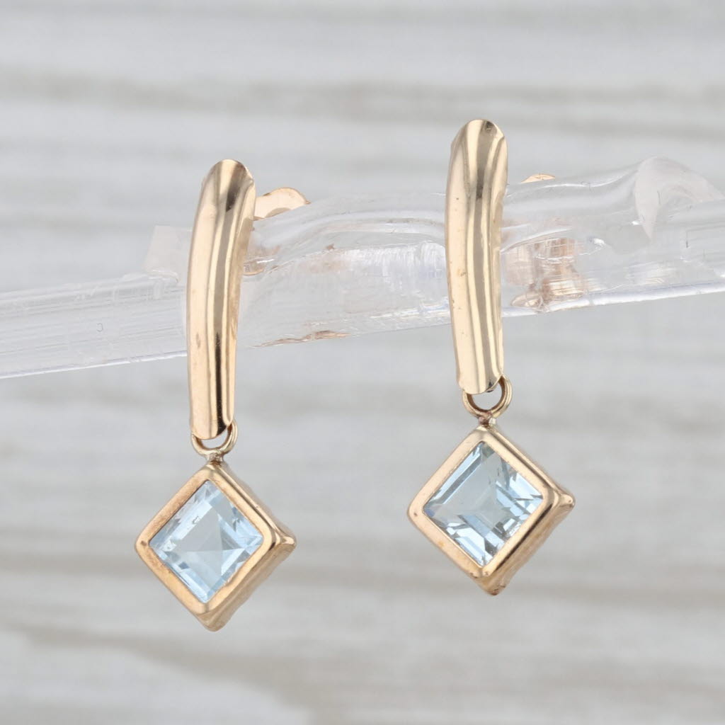 1.14ctw Blue Topaz Dangle Earrings 10k Yellow Gold Pierced Drops