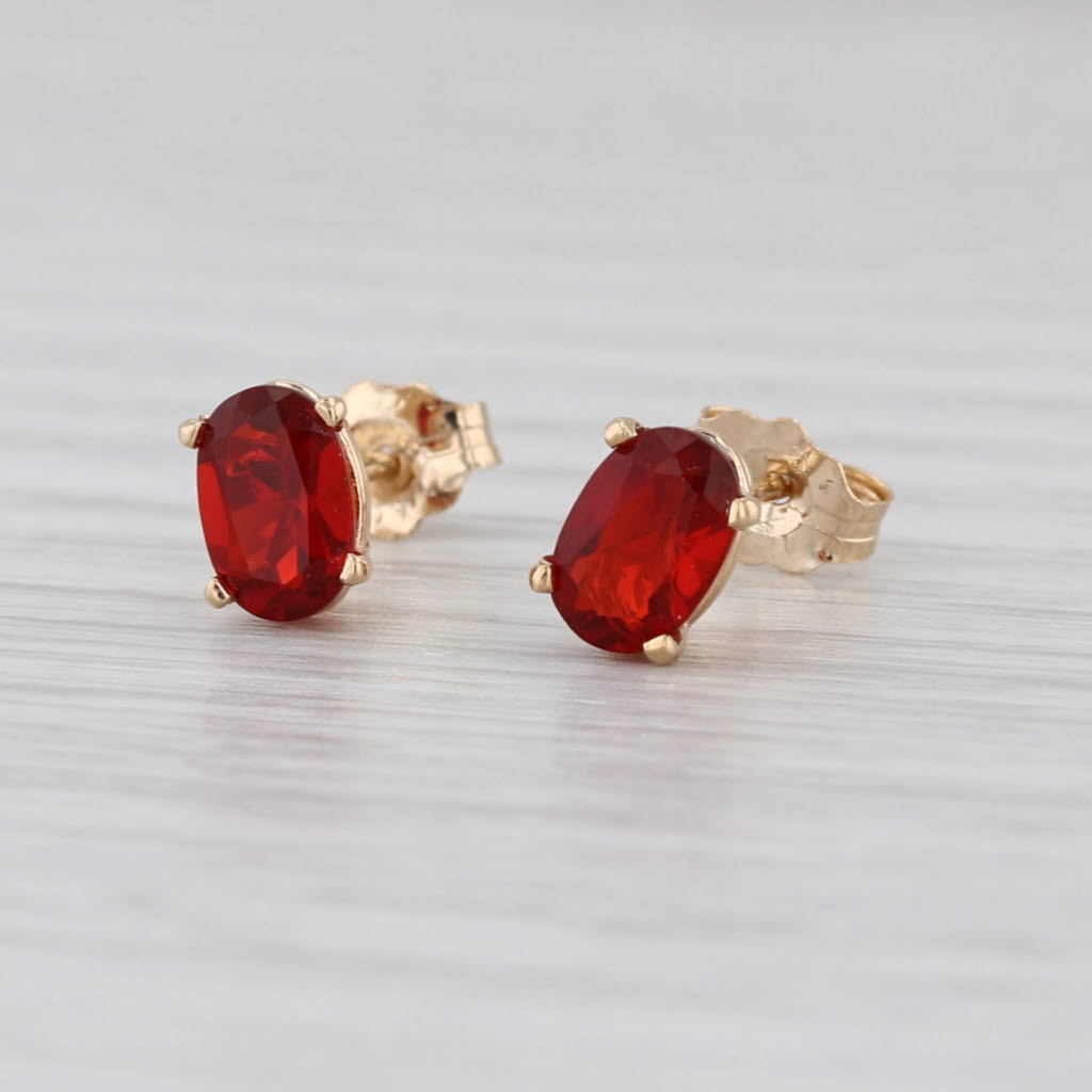 0.56ctw Fire Opal Stud Earrings 14k Yellow Gold Oval Solitaire Studs