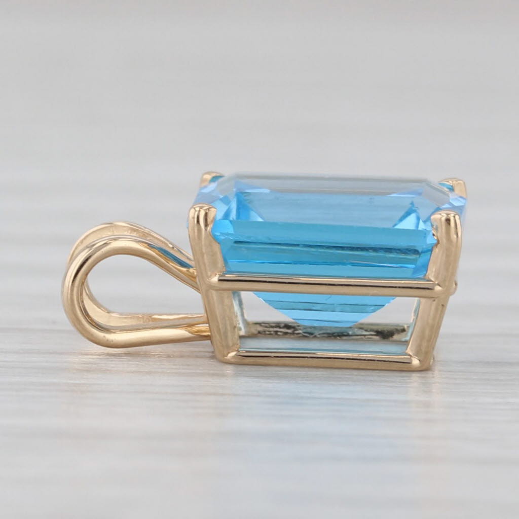 Light Gray 4.25ct Blue Topaz Emerald Cut Solitaire Pendant 14k Yellow Gold