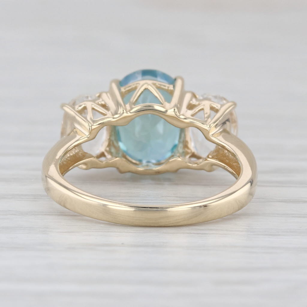 4.80ctw Teal & White Topaz Oval 3-Stone Ring 10k Yellow Gold Size 6