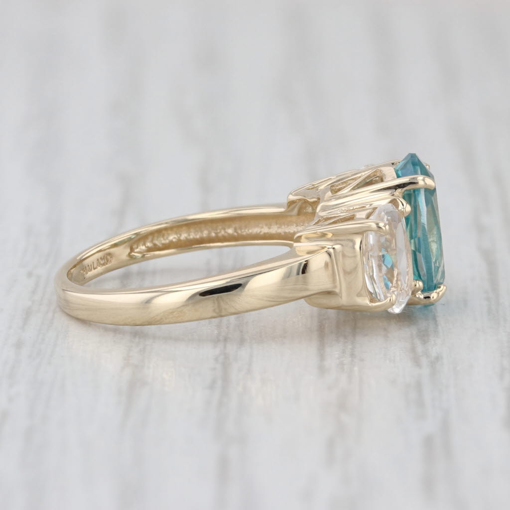 4.80ctw Teal & White Topaz Oval 3-Stone Ring 10k Yellow Gold Size 6