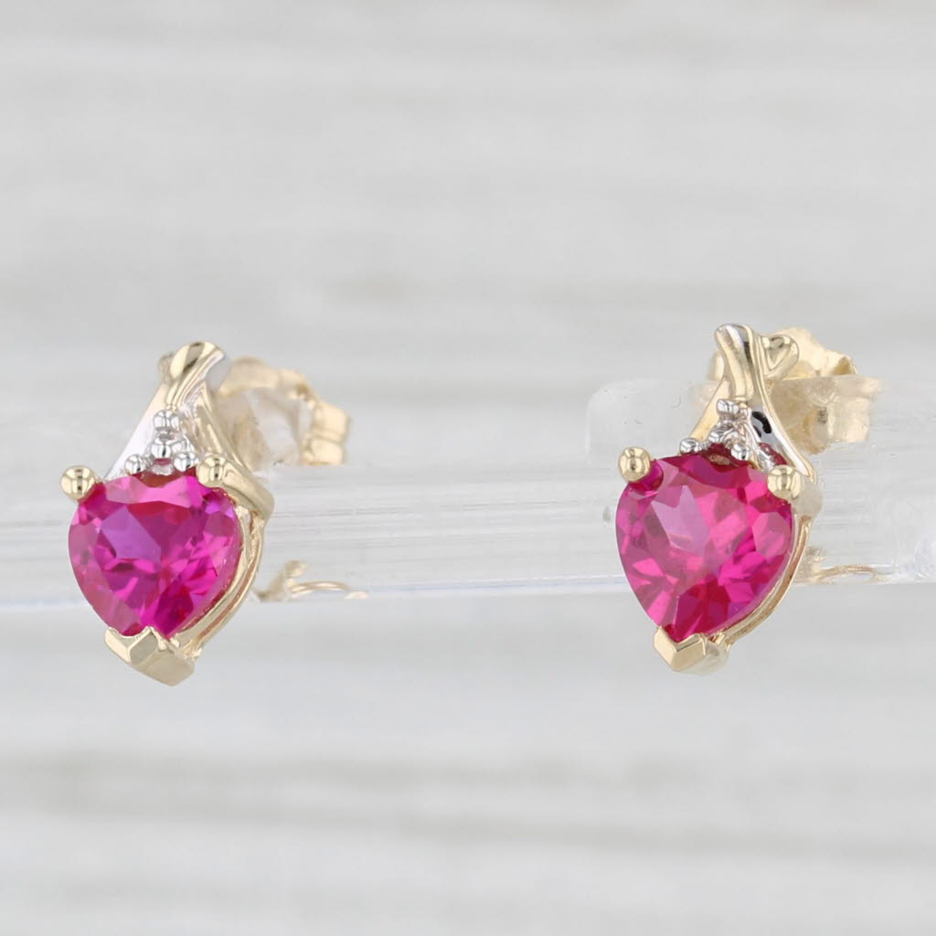 Light Gray 1.20ctw Lab Created Ruby Heart Stud Earrings 10k Yellow Gold