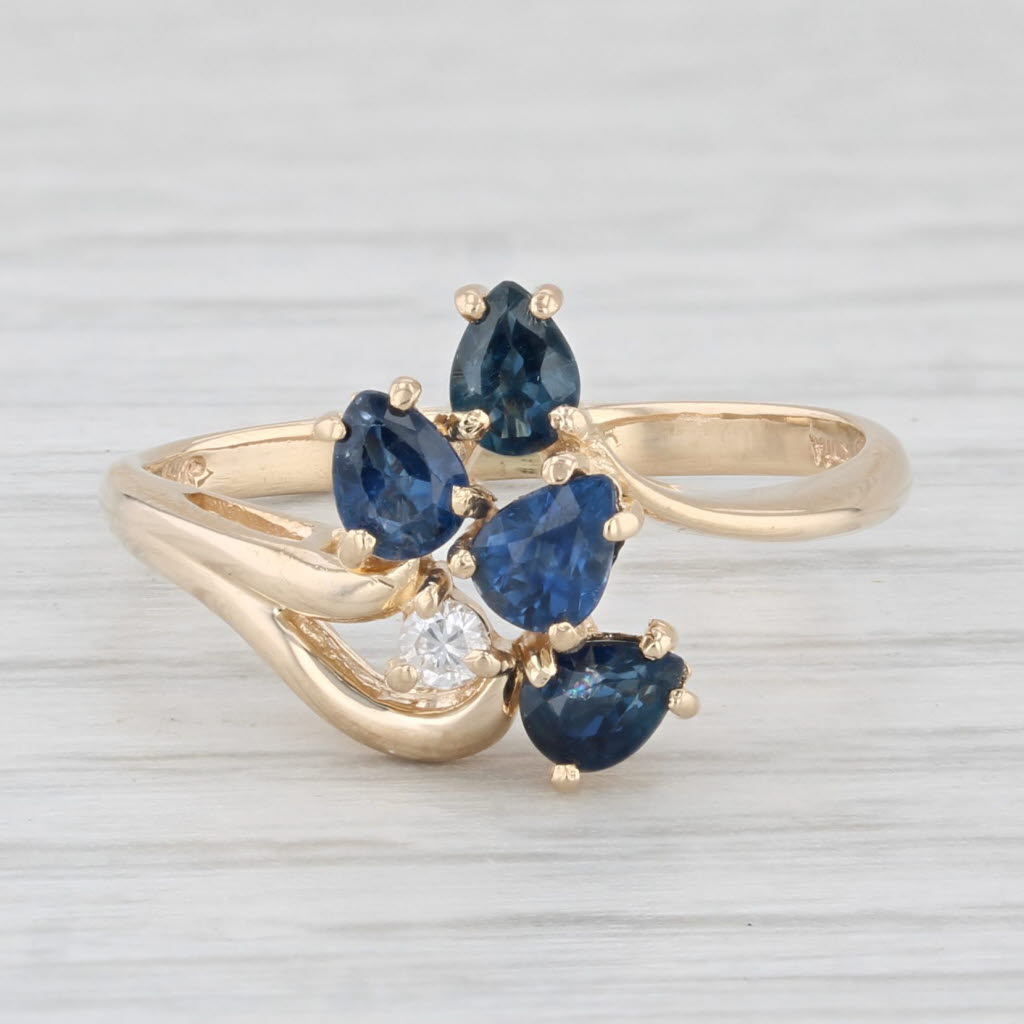 Light Gray 0.83ctw Blue Sapphire Cluster Ring 14k Yellow Gold Size 6 Bypass