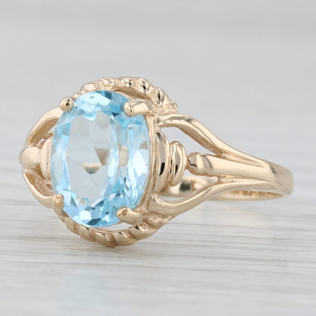 Light Gray 2.15ctw Oval Blue Topaz Solitaire Ring 10k Yellow Gold Size 6.5