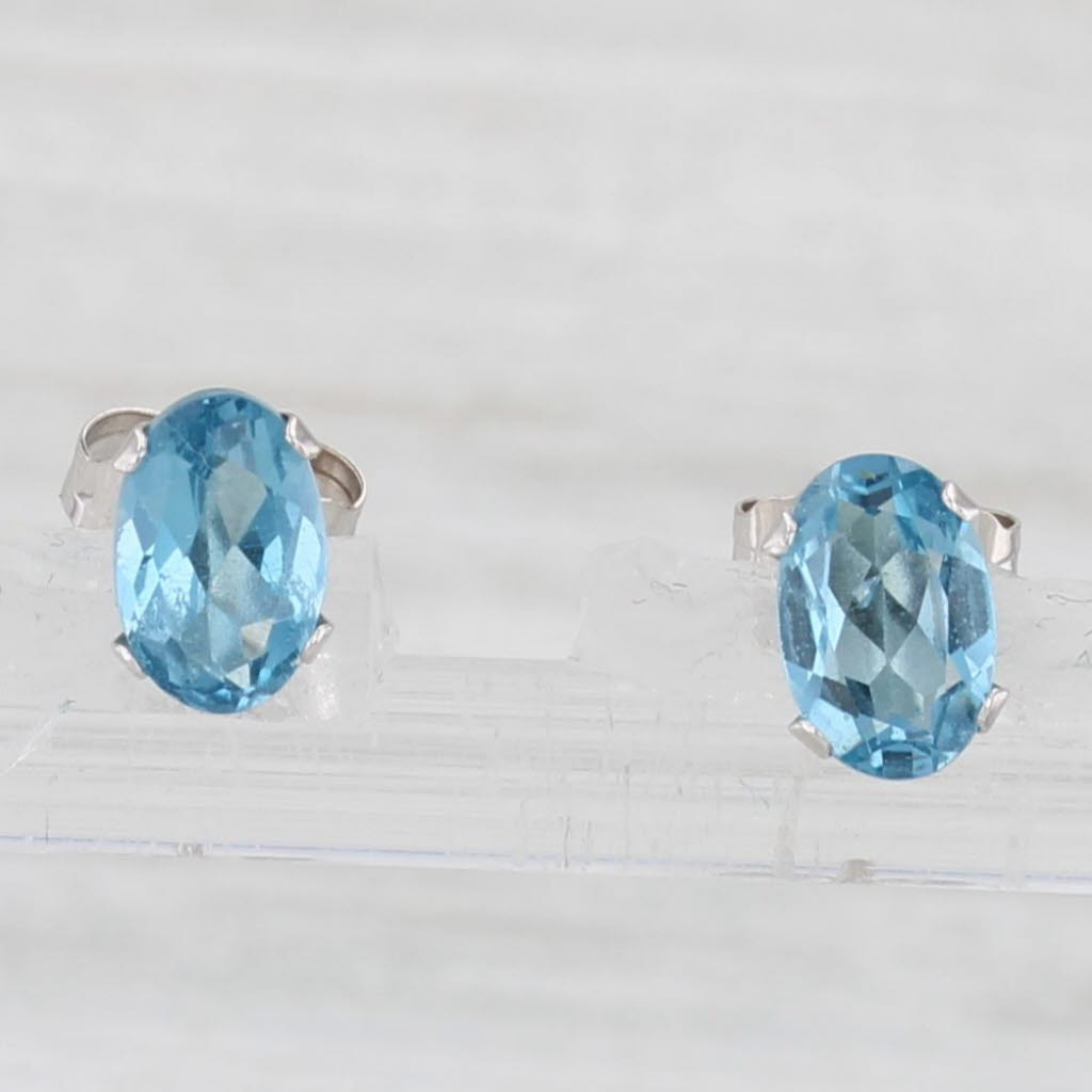 Light Gray 1.10ctw Blue Topaz Stud Earrings 14k White Gold Oval Solitaire Studs