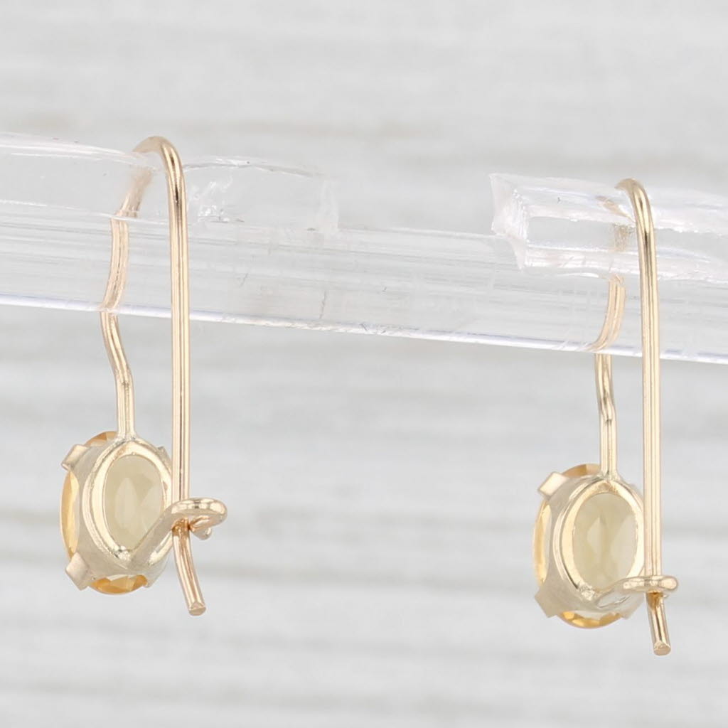 Light Gray 0.80ctw Oval Solitaire Citrine Drop Earrings 14k Yellow Gold Hook Posts