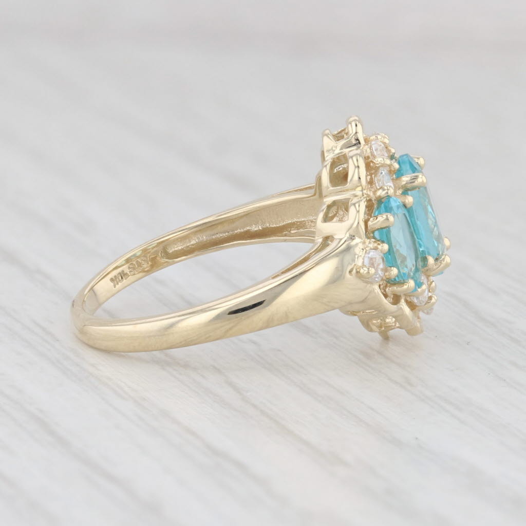 Light Gray 2.31ctw Blue Apatite 3-Stone Cubic Zirconia Ring 10k Yellow Gold Size 7