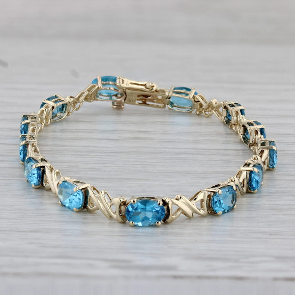 7.10ctw Blue Topaz Tennis Bracelet 10k Yellow Gold 6.75" 4.3mm