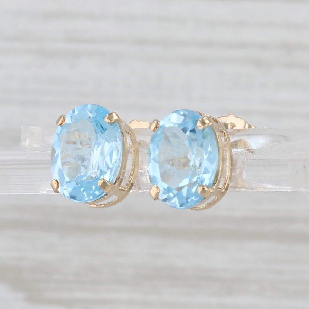 4.30ctw Oval Blue Topaz Stud Earrings 14k Yellow Gold Solitaire Studs