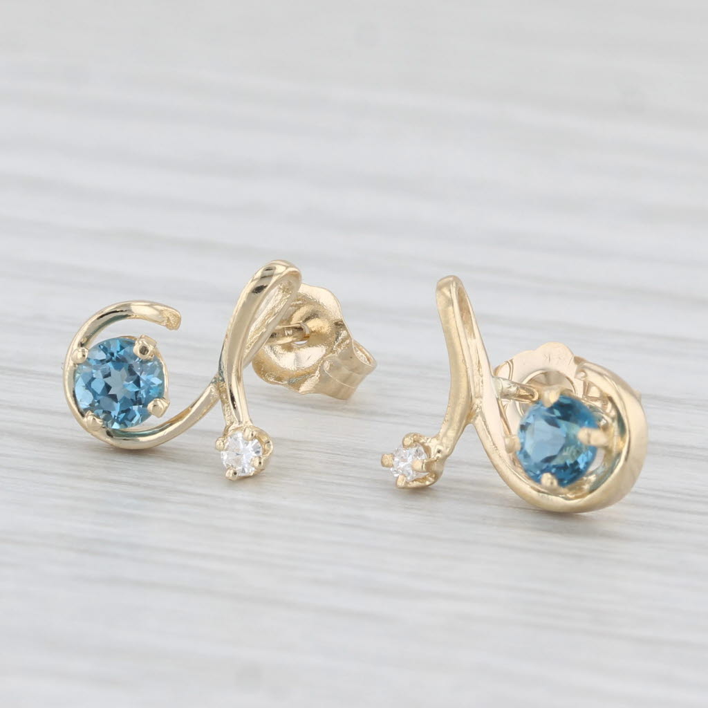 Light Gray 0.48ctw Blue Topaz Diamond Swirl Stud Earrings 14k Yellow Gold