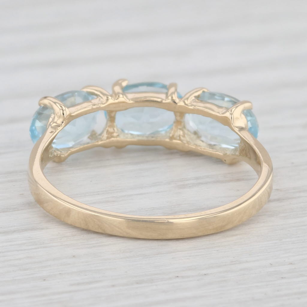 Light Gray 3ctw 3-Stone Oval Blue Topaz Ring 14k Yellow Gold Size 8