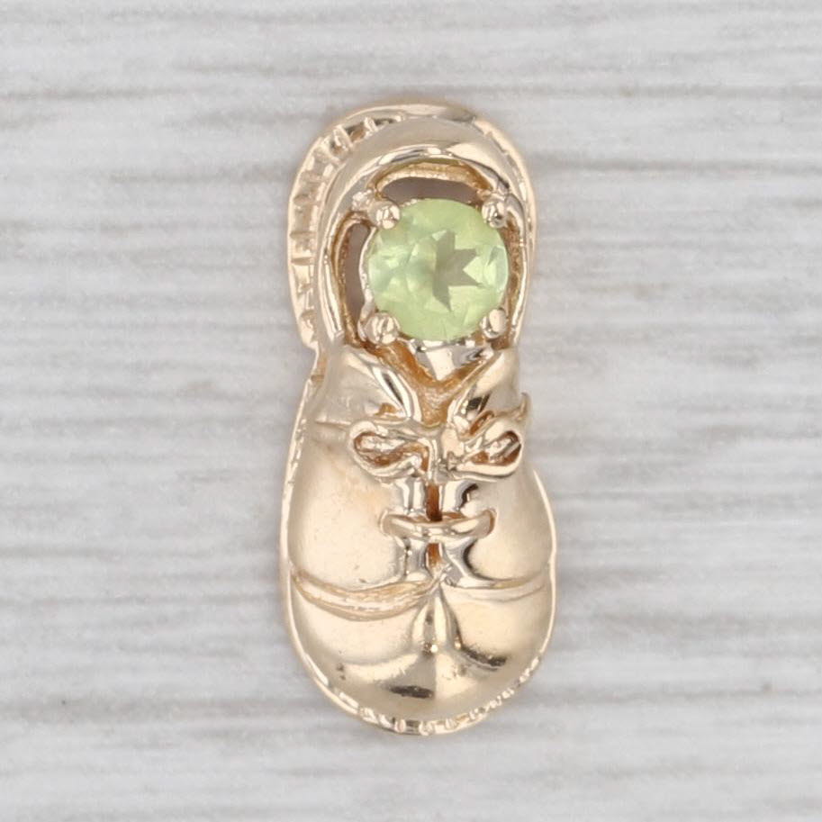 Light Gray 0.12ct Peridot Solitaire Baby Shoe 10k Yellow Gold August Birthstone