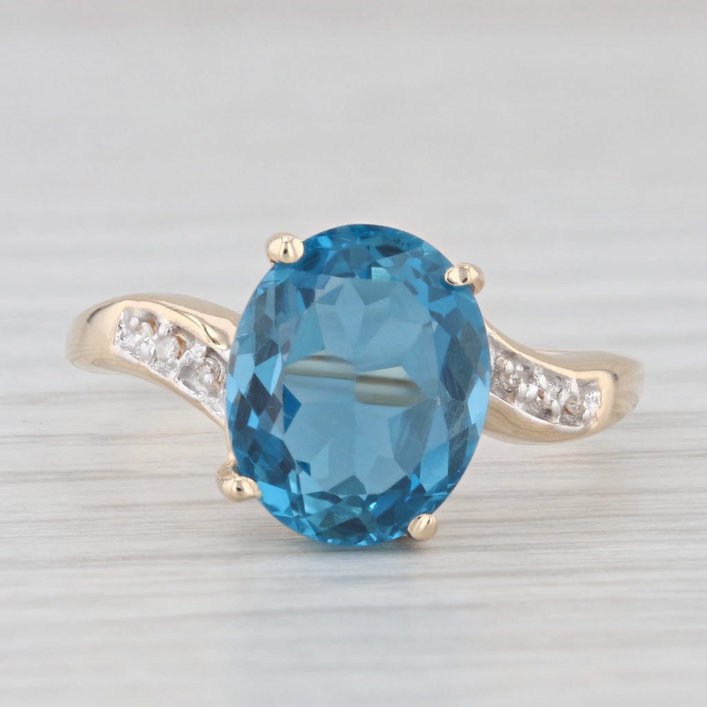 Light Gray 4.67ct Oval Blue Topaz Diamond Bypass Ring 14k Yellow Gold Size 9