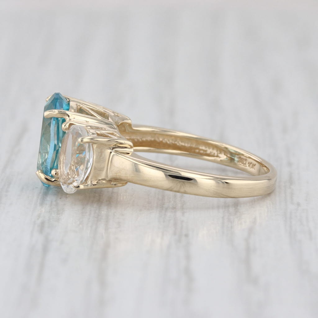 4.80ctw Teal & White Topaz Oval 3-Stone Ring 10k Yellow Gold Size 6
