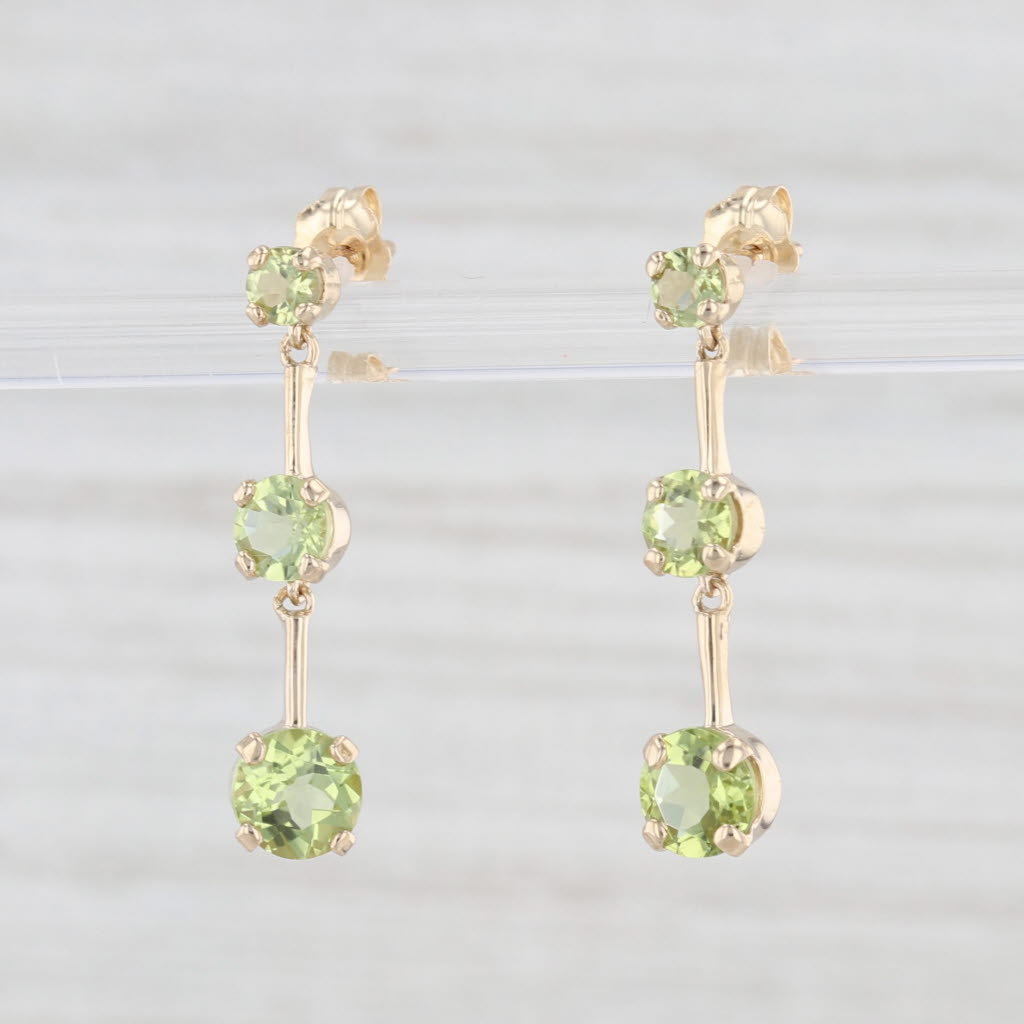 Light Gray 1.85ctw Peridot Graduated 3-Stone Dangle Earrings 10k Yellow Gold