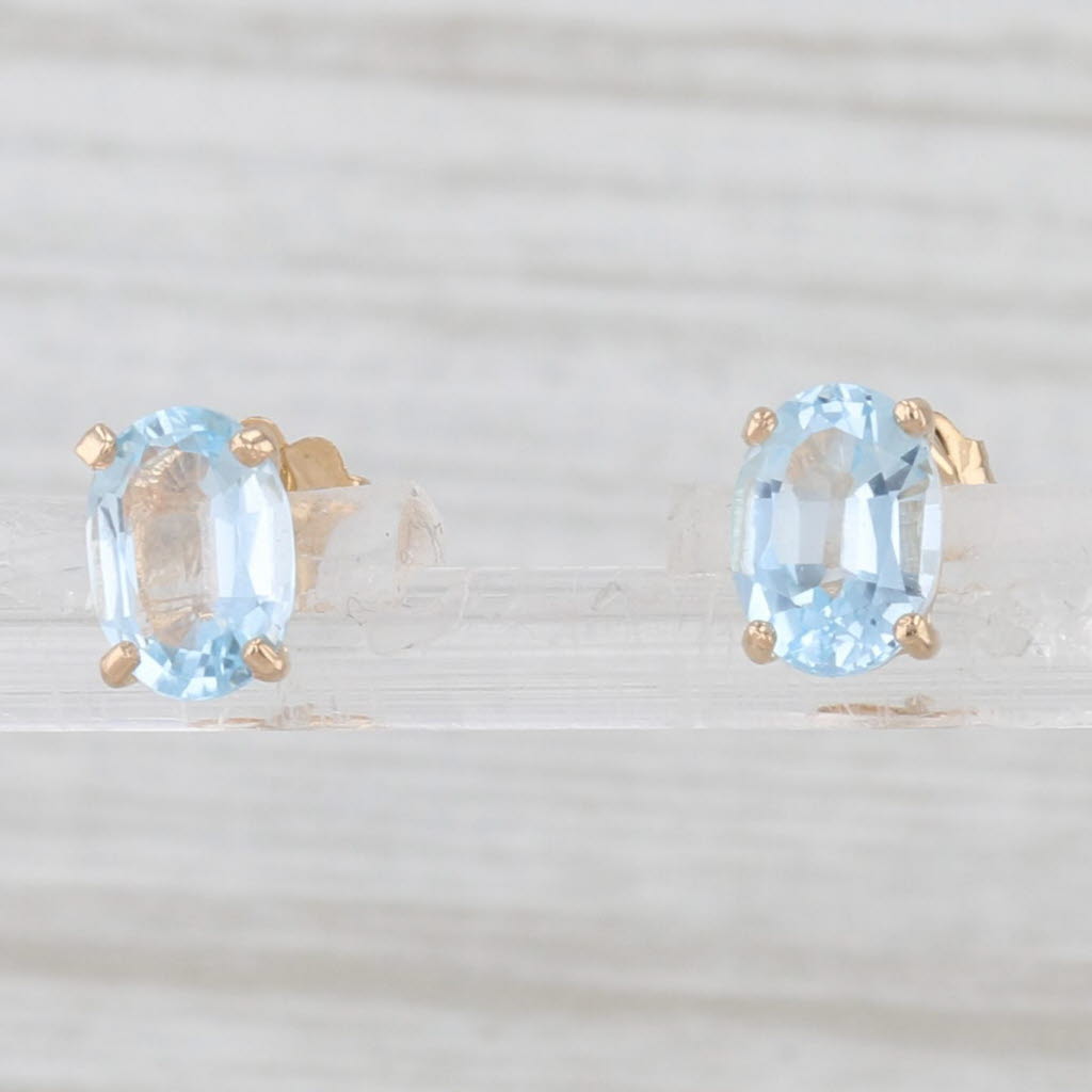 Light Gray 2ctw Oval Blue Topaz Solitaire Stud Earrings 14k Yellow Gold