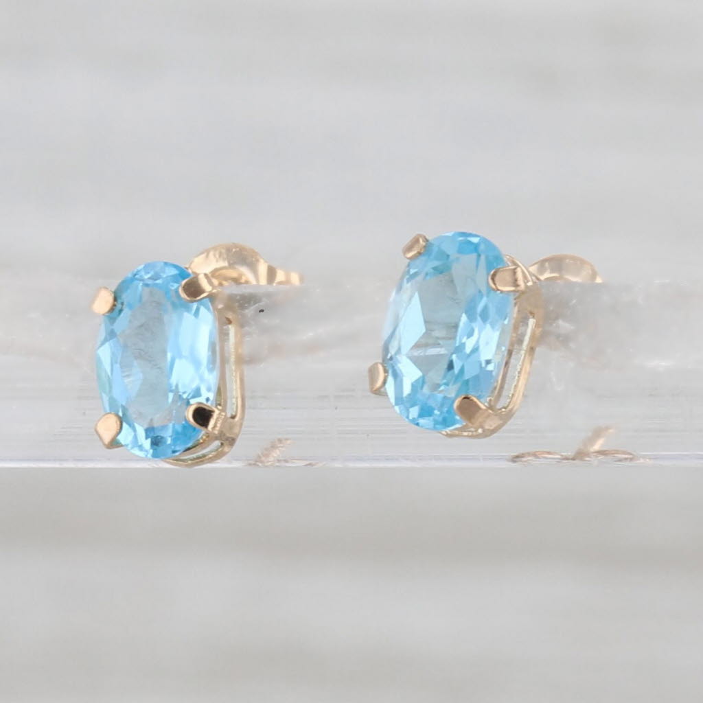 1.10ctw Oval Blue Topaz Stud Earrings 10k Yellow Gold Solitaire Studs