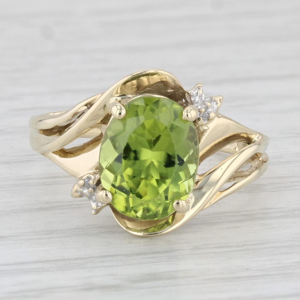 Light Gray 3.08ctw Oval Peridot Ring 10k Yellow Gold Size 7.5 Diamond Accents