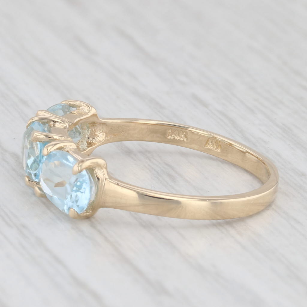 Light Gray 3ctw 3-Stone Oval Blue Topaz Ring 14k Yellow Gold Size 8