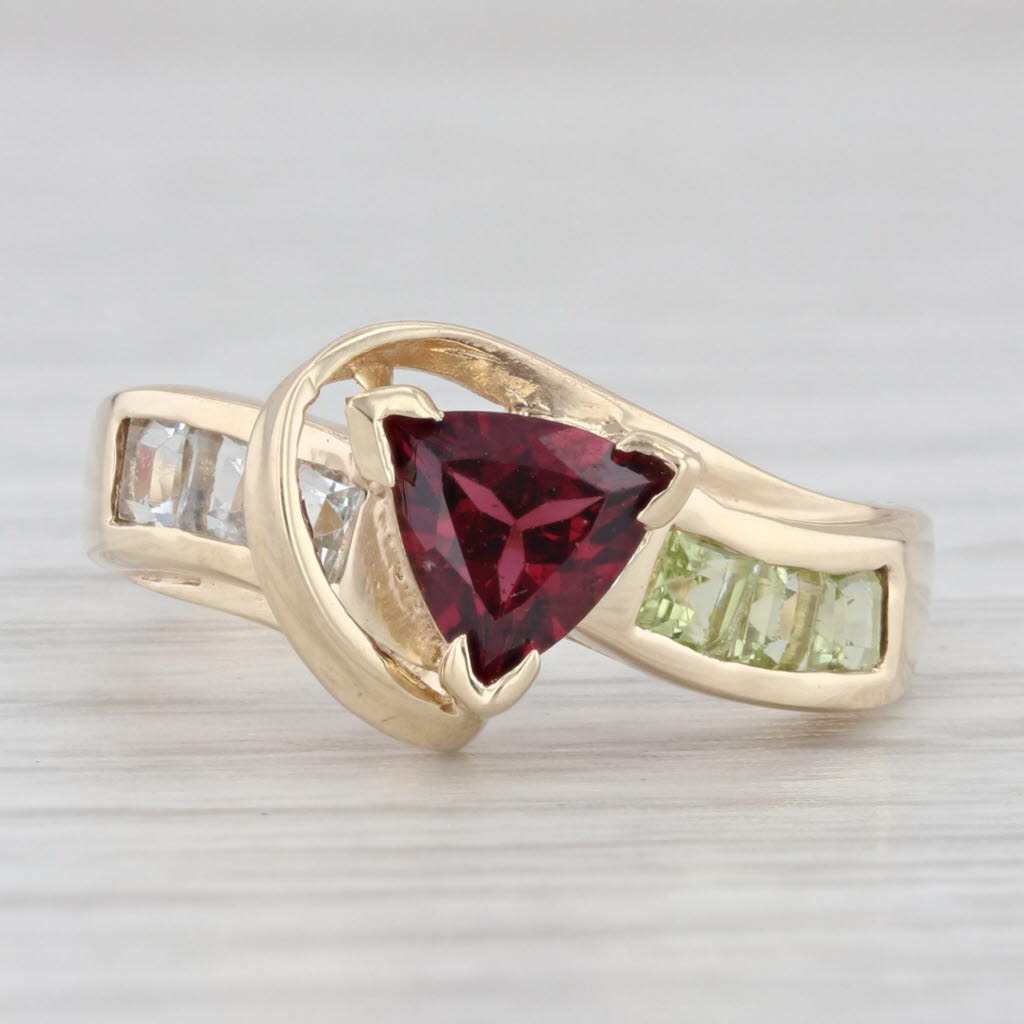 Light Gray 1.11ctw Garnet Peridot Topaz Bypass Ring 10k Yellow Gold Size 6.75