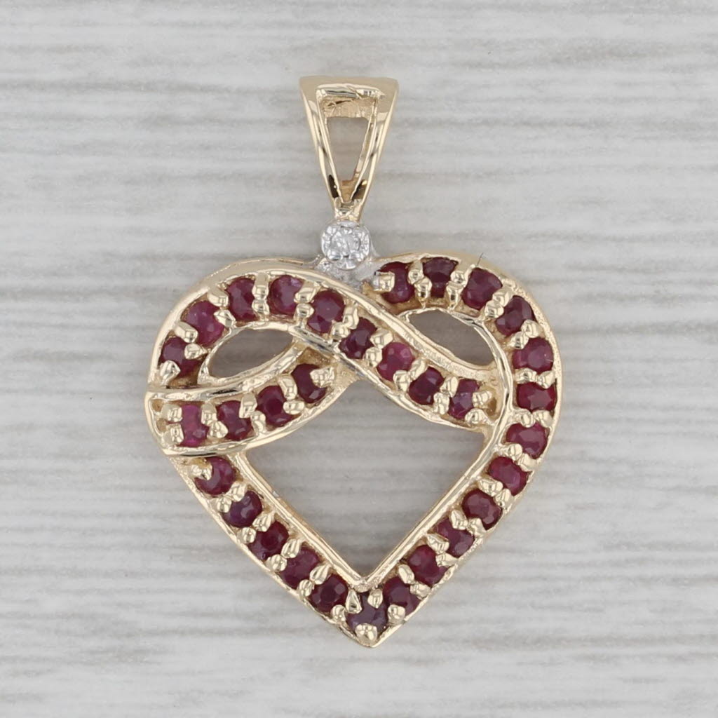 Gray 0.44ctw Ruby Diamond Knotted Heart Pendant 10k Yellow Gold