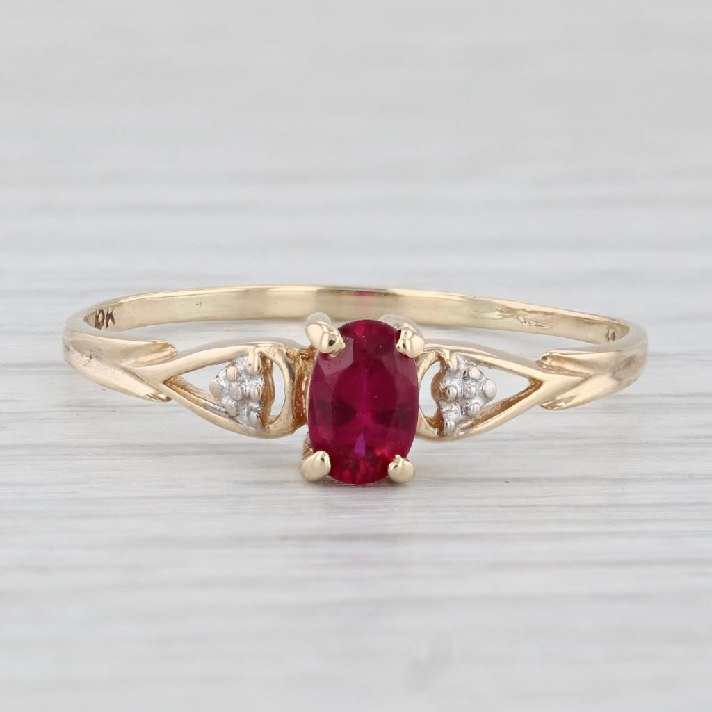 Light Gray 0.50ctw Oval Lab Created Ruby Ring 10k Yellow Gold Size 10.75