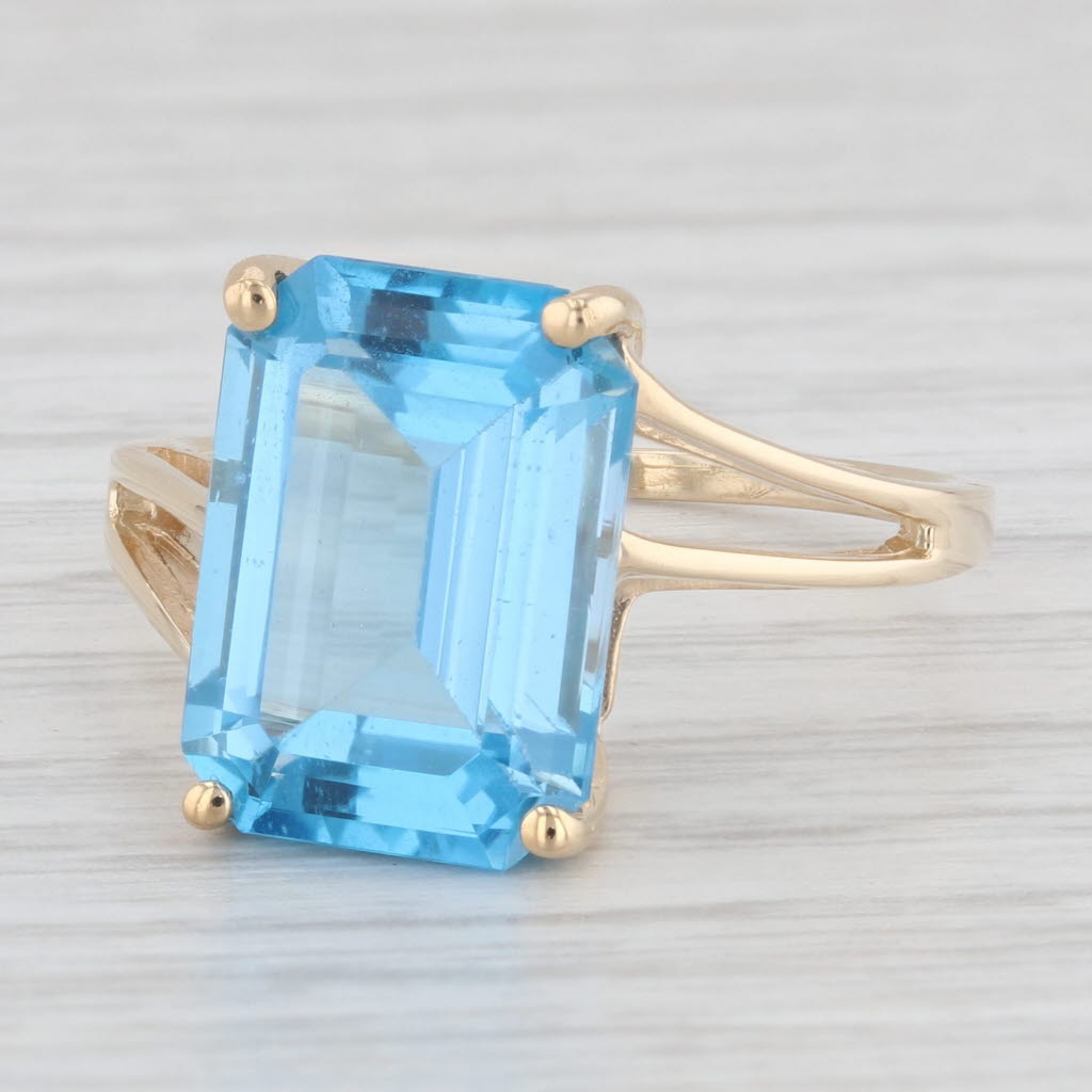 Light Gray 9.10ct Emerald Cut Blue Topaz Solitaire Ring 10k Yellow Gold Size 9