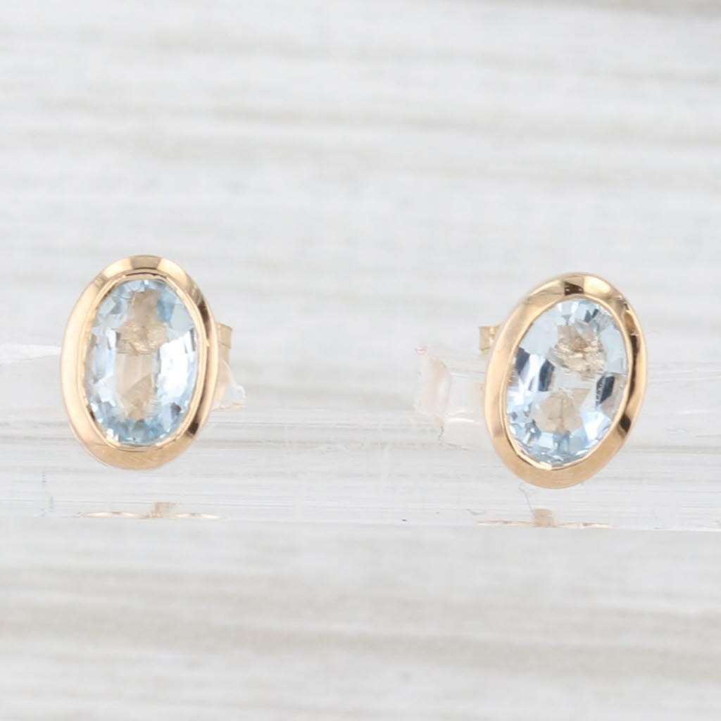 Light Gray 0.80ctw Aquamarine Stud Earrings 14k Yellow Gold Oval Solitaires