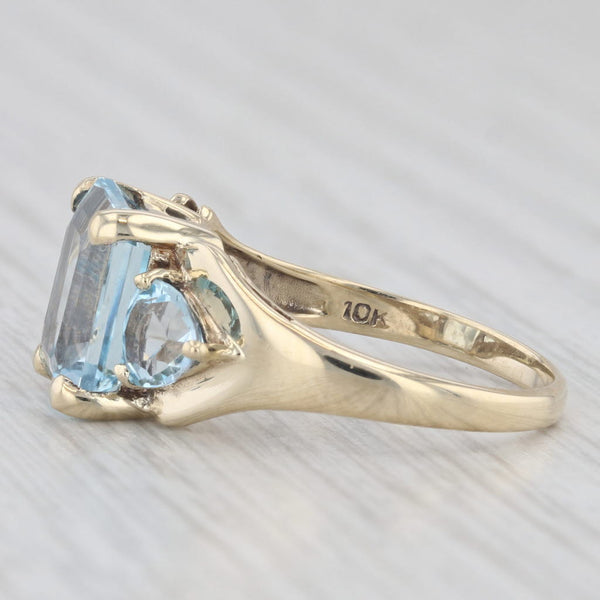 Light Gray 5.50ctw Emerald Cut Blue Topaz Ring 10k Yellow Gold Size 7