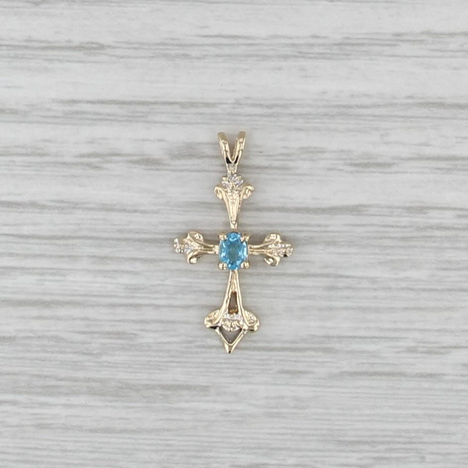 0.16ct Blue Topaz Cross Pendant 14k Yellow Gold Diamond Accents