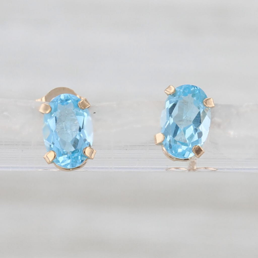 1.10ctw Oval Blue Topaz Stud Earrings 10k Yellow Gold Solitaire Studs